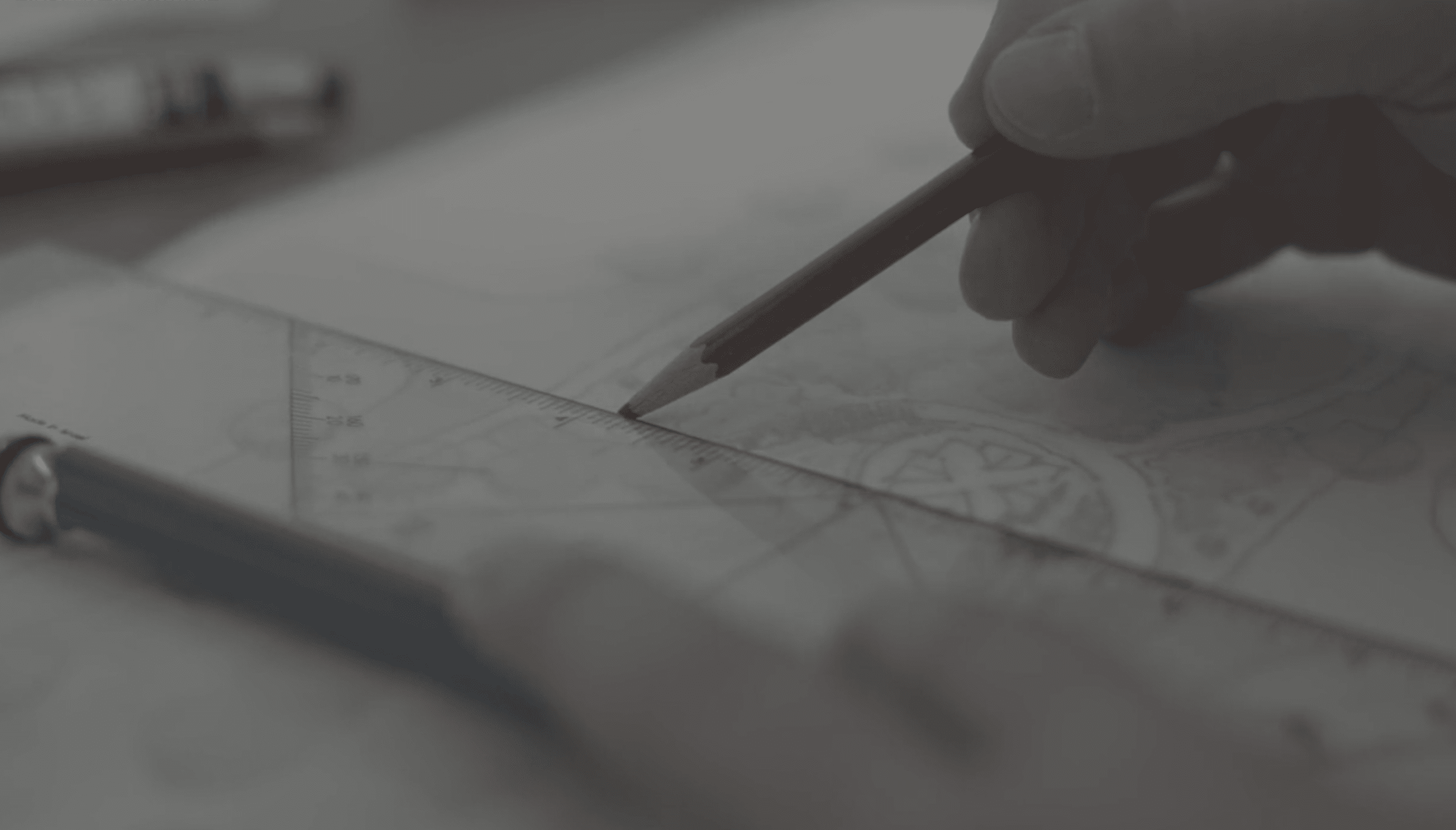 A stack of papers with a person blurred out in the background